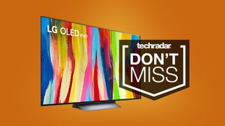 LG C2 TV on orange background with sign saying Don't Miss