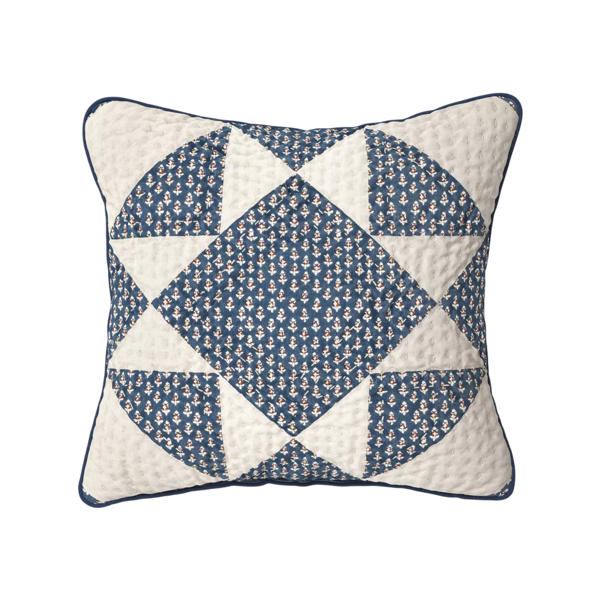 a blue and white patchwork pillow