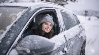 Happy young woman on a winter journey