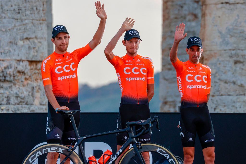 Team CCC rider Russias Ilnur Zakarin c and his teammates wave on stage at the Doric Temple of Segesta near Palermo Sicily on October 1 2020 during an opening ceremony of presentation of participating teams and riders two days ahead of the departure of the Giro dItalia 2020 cycling race Photo by Luca Bettini AFP Photo by LUCA BETTINIAFP via Getty Images
