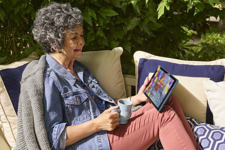 Best tablet for video calling: Fire HD 10 Tablet in use by grandma on couch in garden