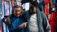 Trevor Slattery (Sir Ben Kingsley) and Simon Williams (Yahya Abdul-Mateen II) embrace on Wonder Man.