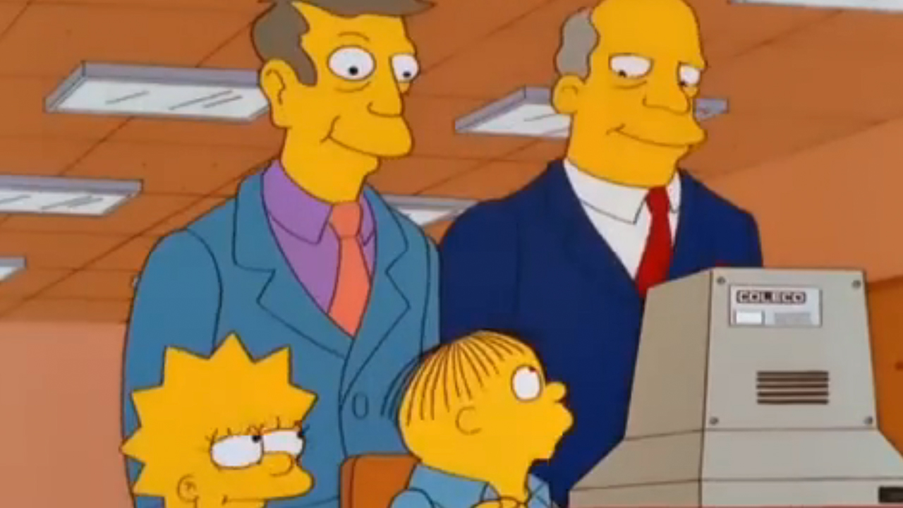 Ralph Wiggum sitting at a computer with Principal Skinner and Superintendent Chalmers standing behind him.