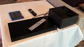 LG M3 Zero Connect box next to blu-ray player