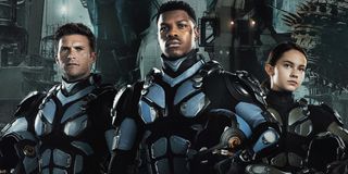 Pacific Rim Uprising Scott Eastwood John Boyega and Cailee Spaeny stand proudly in their Jaeger suit