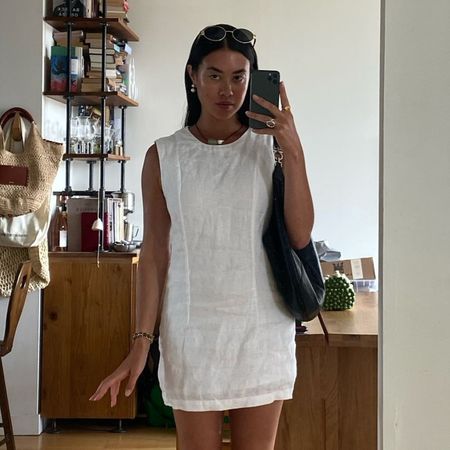 Influencer wears a shift dress.