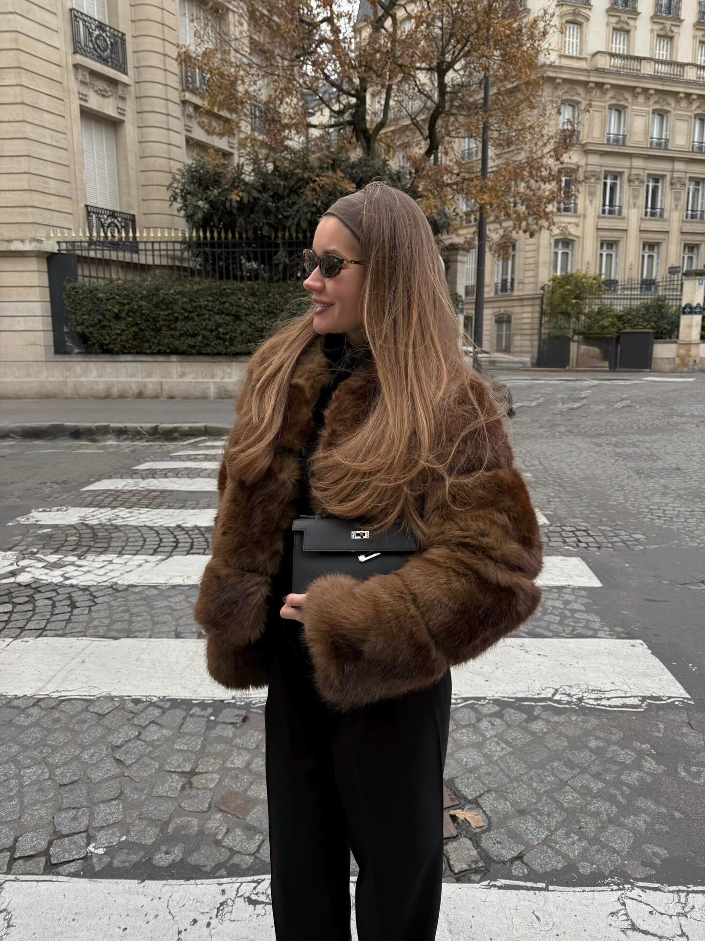 Woman in a brown faux-fur jacket in Paris
