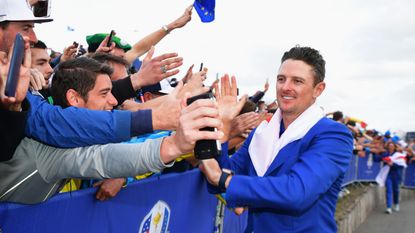 Justin Rose pictured celebrating with fans at the Ryder Cup