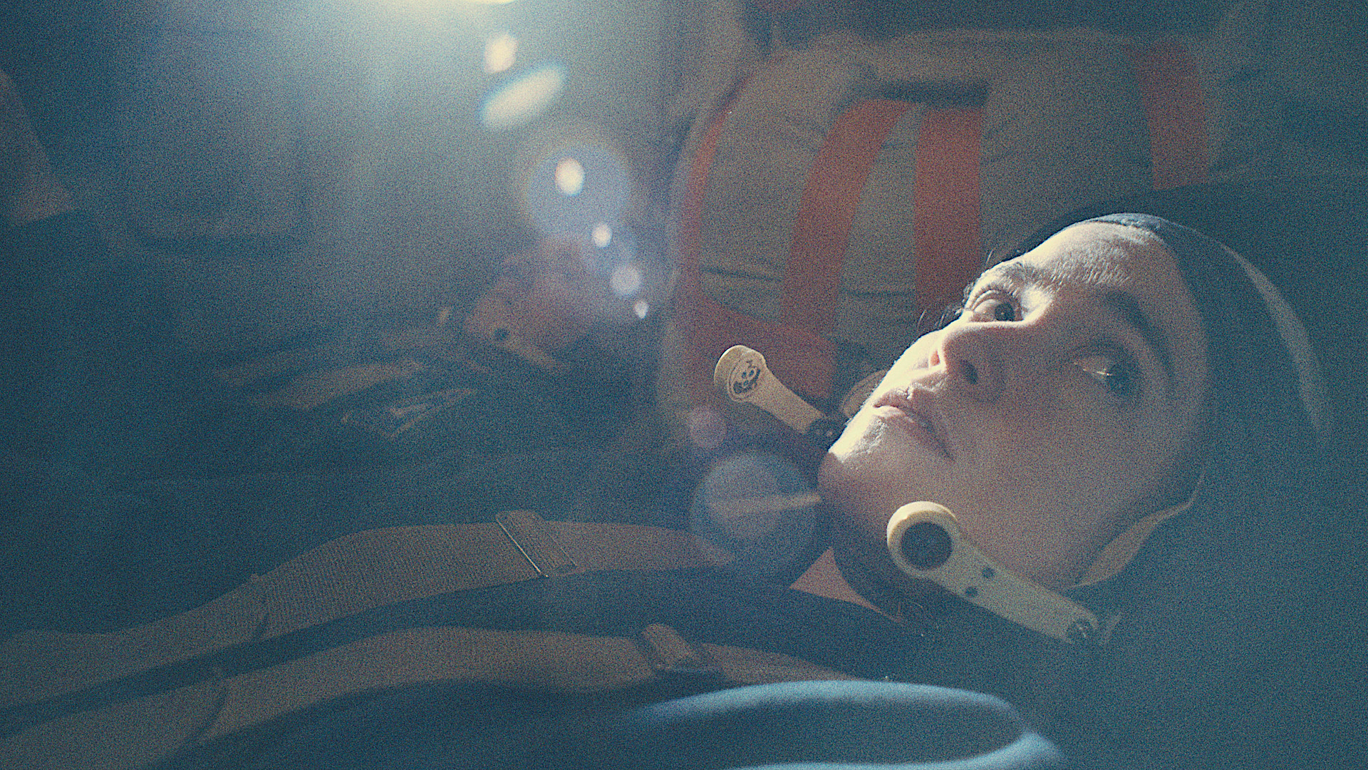 a female cosmonaut in a spacecraft