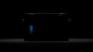 Silhouette of a Fujifilm camera, with a small lightspot revealing a film cannister-like window