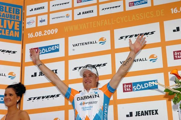 Tyler Farrar celebrates his victory on the podium.