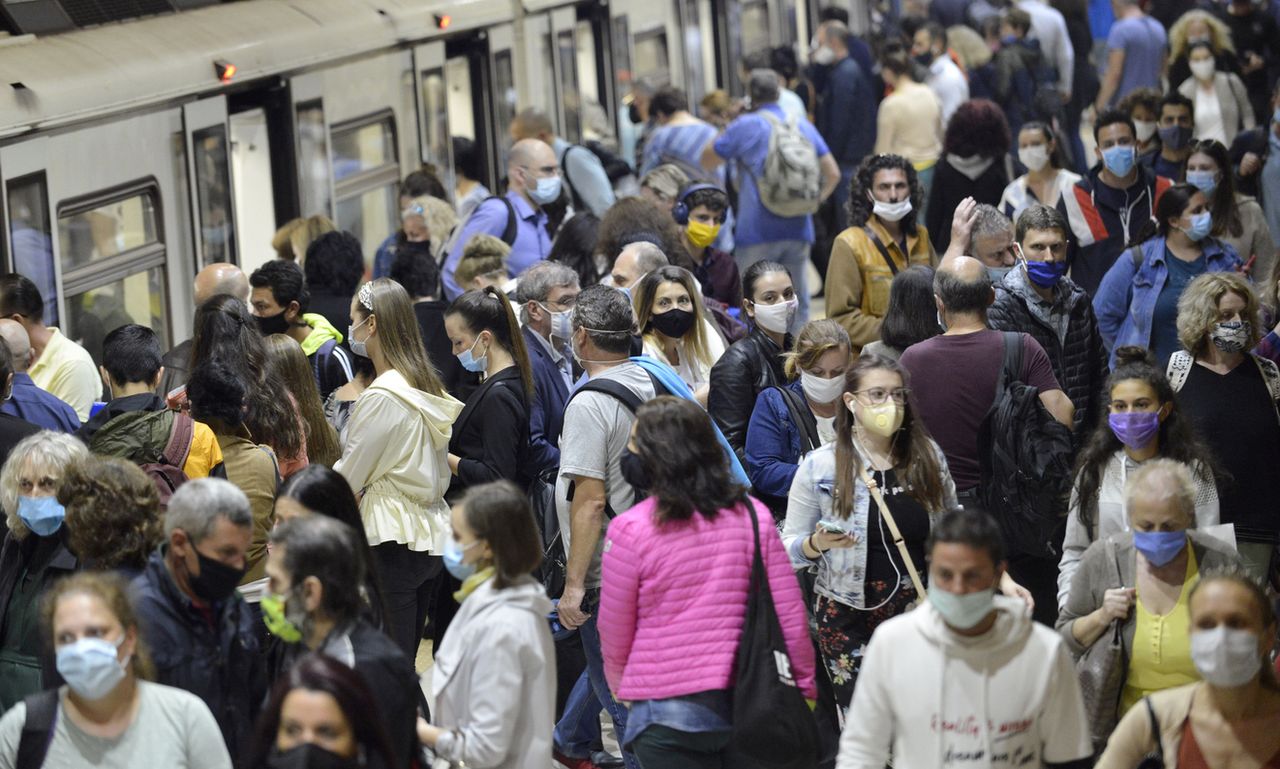 Crowd of people wearing masks