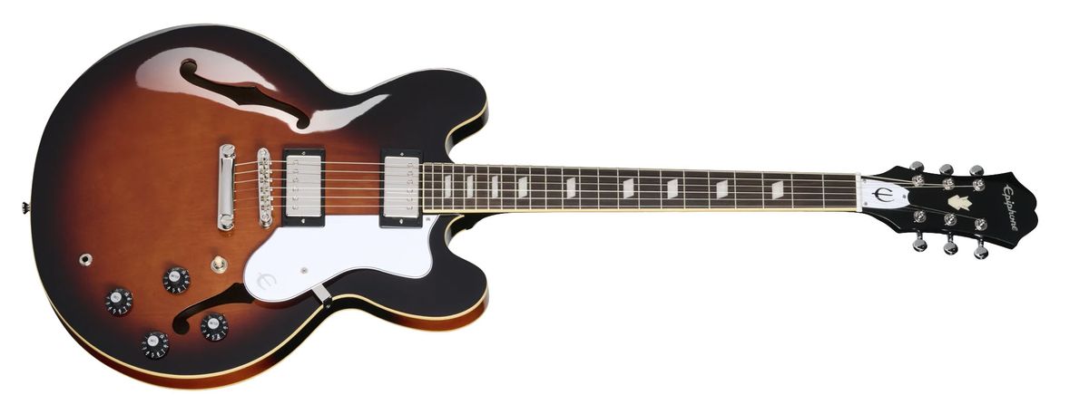 Epiphone Bonehead Riviera: the new signature guitar for the Oasis guitarist is a classy marque that's finished in Dark Tobacco Sunburst. It looks particularly good photographed in low light against a Mark Series Mesa/Boogie combo.
