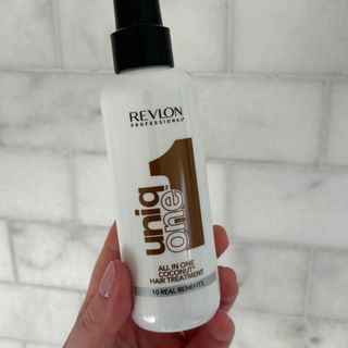 Laura holding Revlon Professional Uniq One All In One Coconut Hair Treatment - best hair conditioner