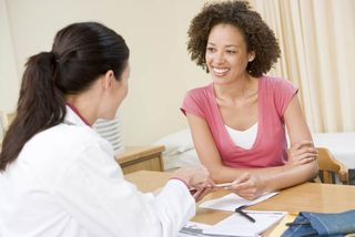 a woman talking to her doctor.