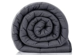 rolled up dark grey blanket