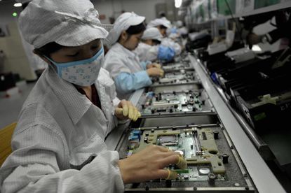 Workers at Foxconn's factory in Shenzhen, China.
