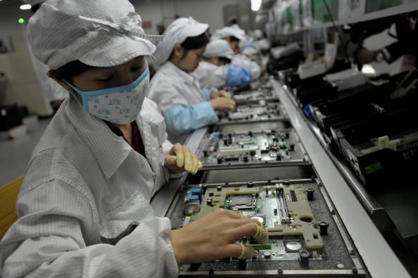 Workers at Foxconn&amp;#039;s factory in Shenzhen, China.