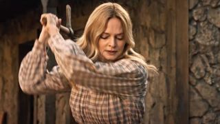 Heather Graham bringing the axe down in &quot;Place of Bones.&quot;