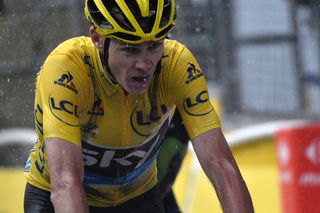 A soggy Chris Froome finishes stage 9 at the Tour de France with his overall lead intact.