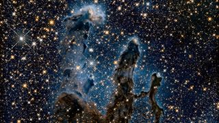 The Eagle Nebula’s Pillars of Creation imaged by the Hubble Space Telescope, in infrared.