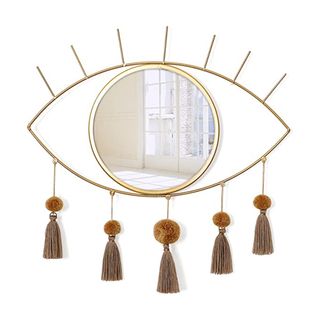 Decorative wall mirror in evil eye design with pompom tassels