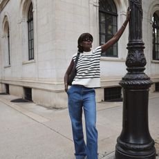 Amy Julliette Lefévre in a striped sweater vest and jeans.