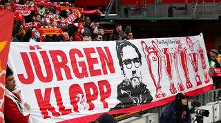 Liverpool fans hold up a banner dedicated to manager Jurgen Klopp ahead of the Reds' FA Cup tie against Norwich City after the news that the German will leave the Anfield club at the end of the season.