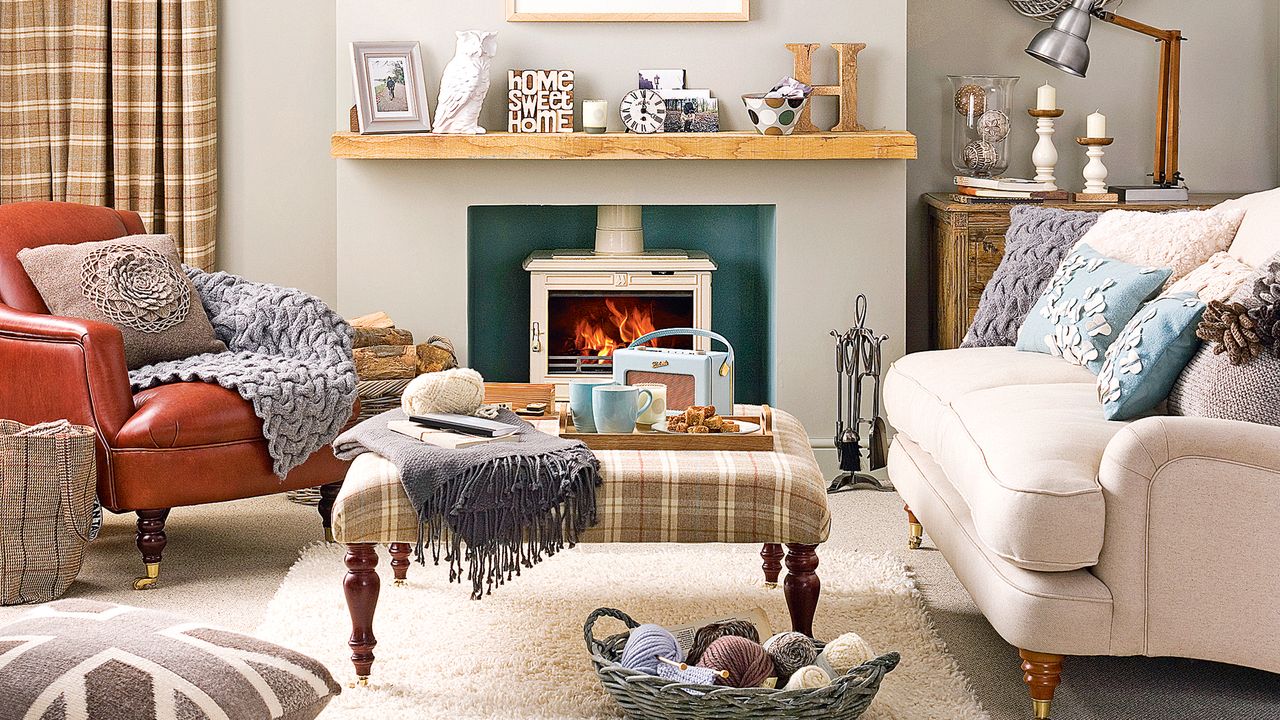 Neutral living room with cream wood burning stove by patterned ottoman 