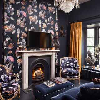living room with black and wallpapered wall and fireplace