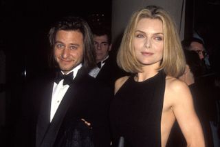 Fisher Stevens and Michelle Pfeiffer at an awards ceremony in the 90s