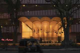 Looking into the building's lobby at night