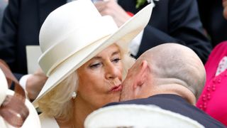 Queen Camilla and Mike Tindall share a kiss