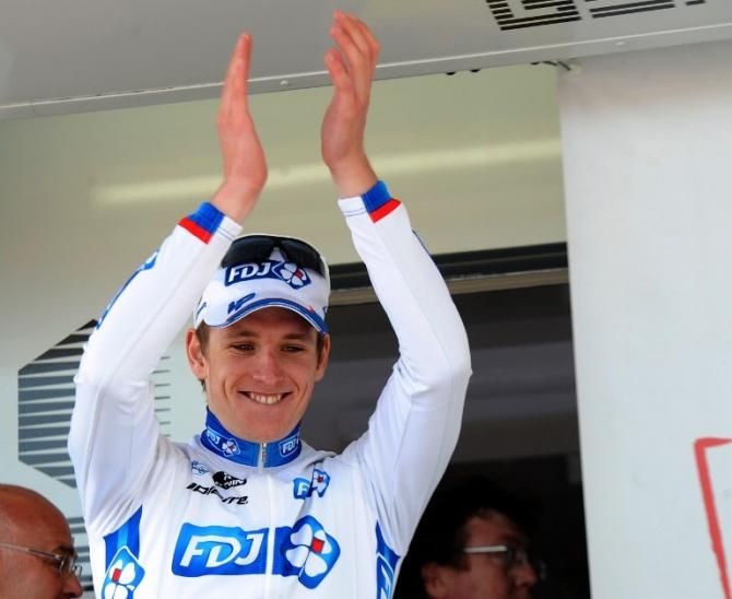 Arnaud Demare (FDJ) steps onto the podium after winning his third straight stage
