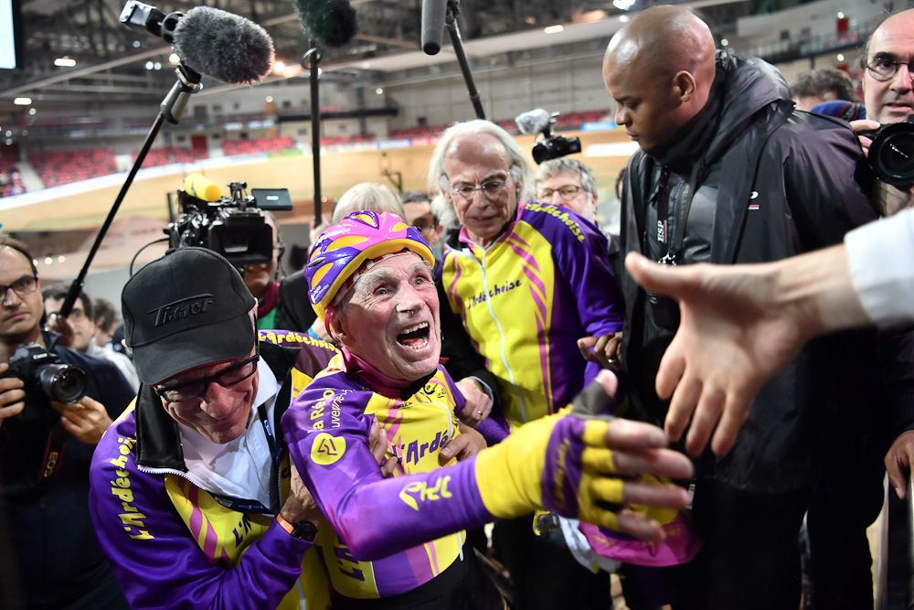 French centenarian cyclist Robert Marchand reacts after setting a one-hour track cycling World record at 22.547km in the over-105 age group