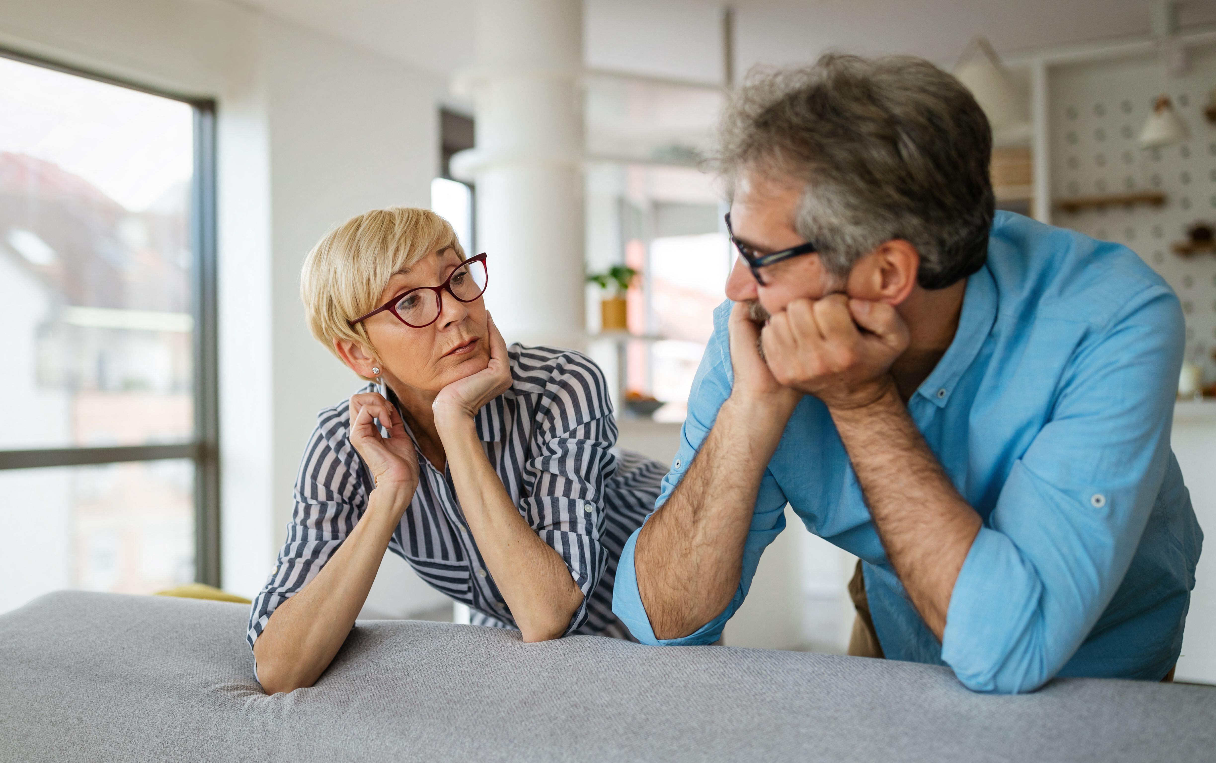 2F64FJD Handsome senior man and attractive old woman are having relationship problems