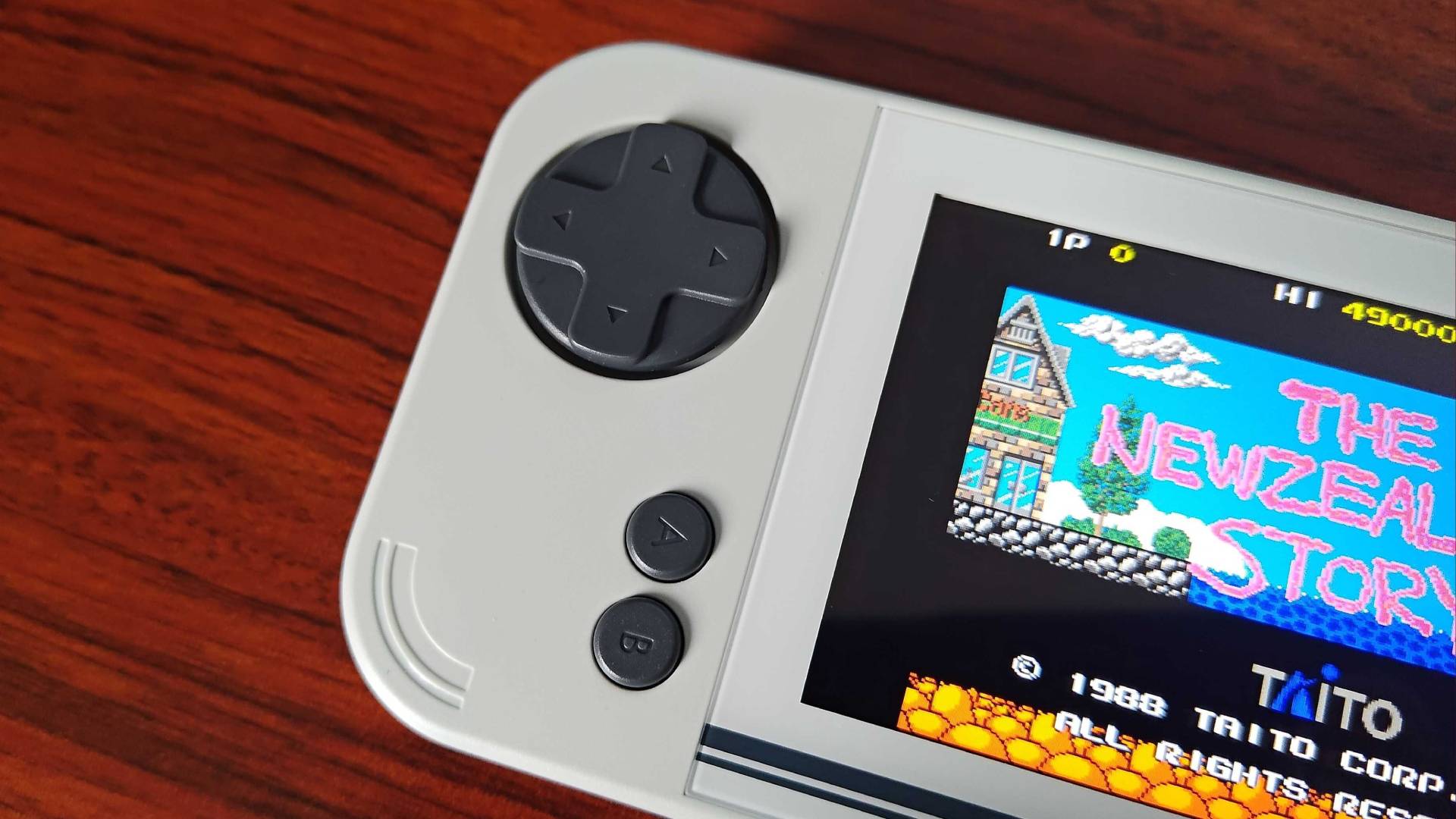 Close up of Evercade EXP-R D-pad and TATE face buttons.