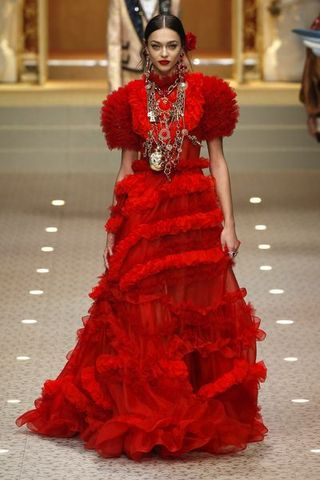 Fashion model, Red, Fashion, Gown, Dress, Clothing, Haute couture, Shoulder, Fashion design, Event,