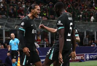 MILAN, ITALY - SEPTEMBER 17: Virgil van Dijk of Liverpool FC celebrates his goal with his team-mate Ibrahima Konate during the UEFA Champions League 2024/25 League Phase MD1 match between AC Milan and Liverpool FC at Stadio San Siro on September 17, 2024 in Milan, Italy. (Photo by Marco Luzzani/Getty Images)