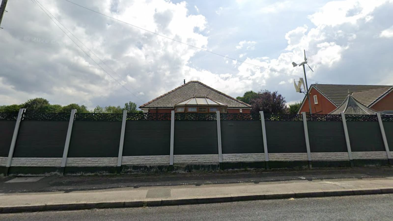 A composite fence around a house