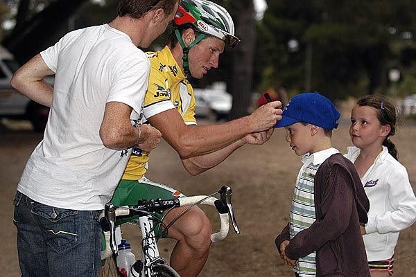 Always popular with fans, Mark Renshaw makes time to sign autographs for these youngsters