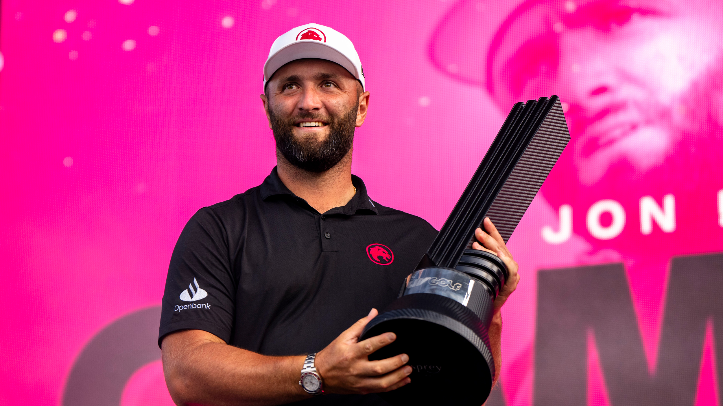Jon Rahm poses with the LIV Golf Chicago trophy after winning in 2024