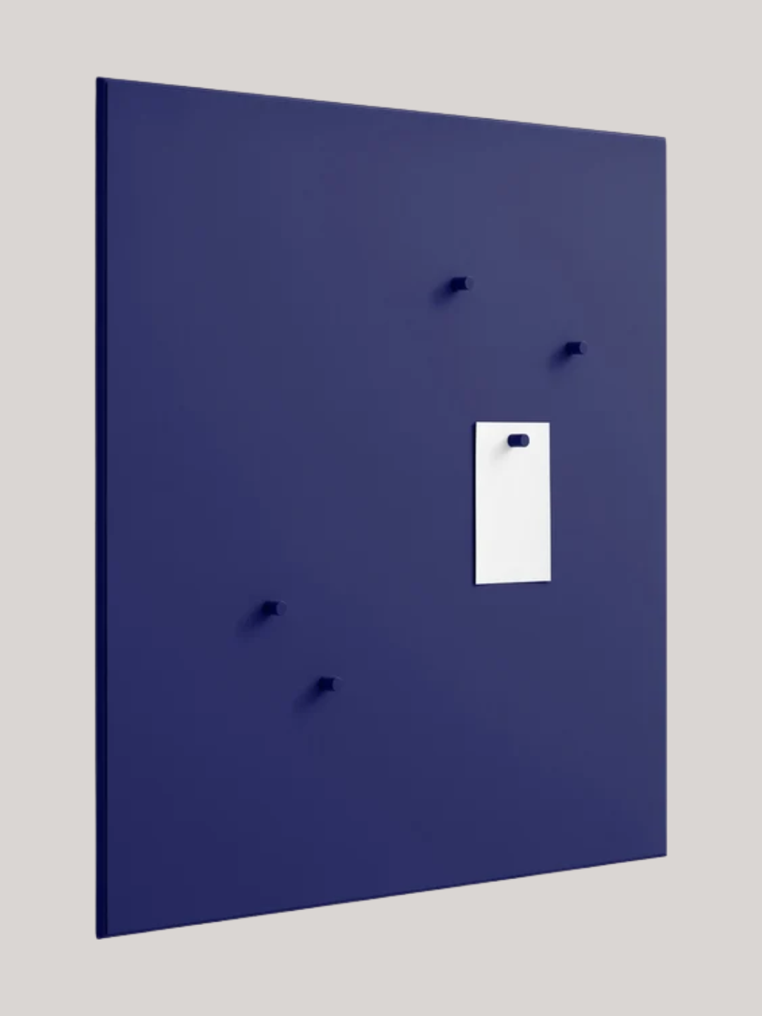 A cobalt blue magnetic noticeboard with magnets from Montana Furniture