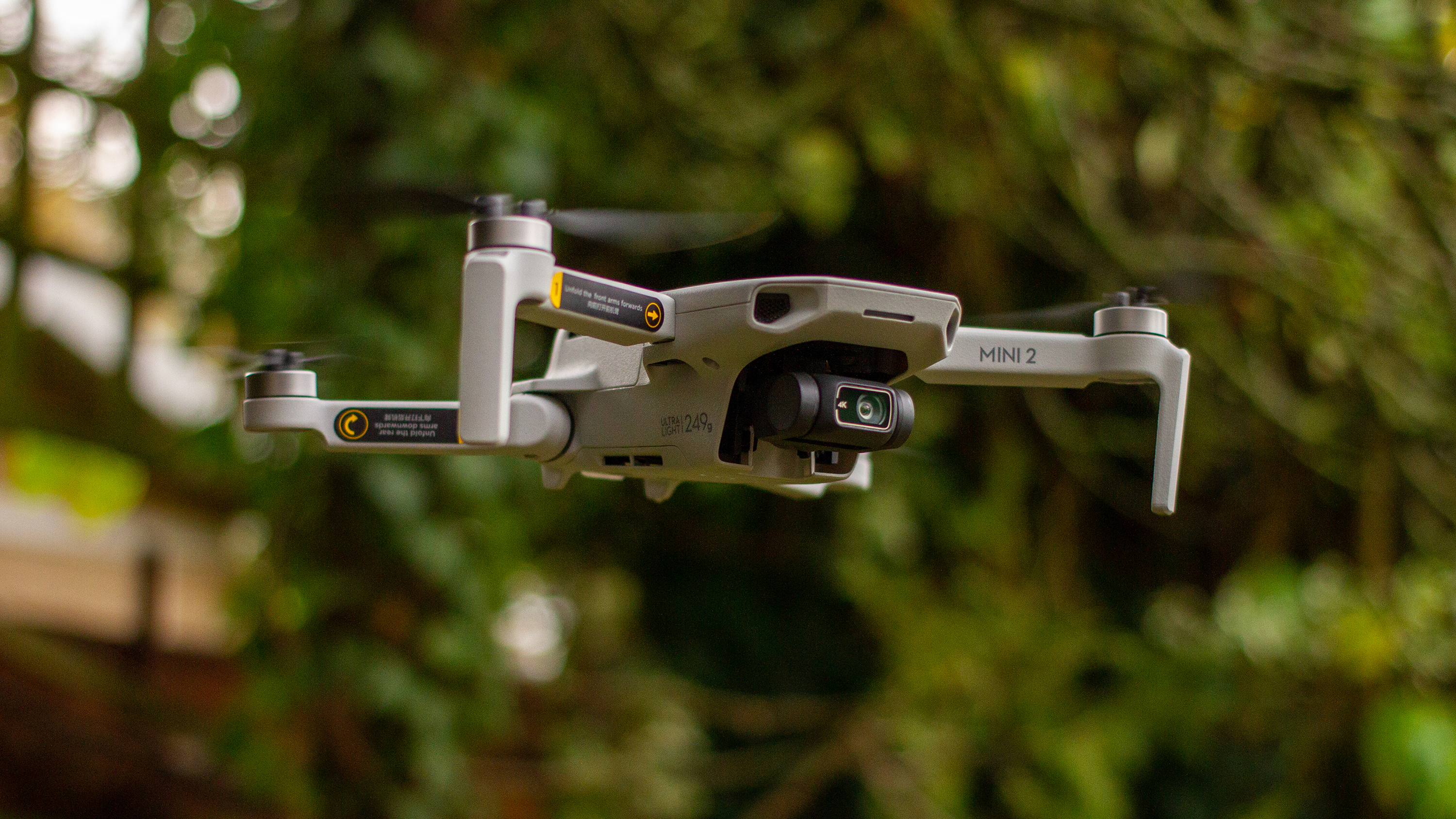 The DJI Mini 2 in flight in a garden