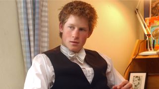 Prince Harry Sits At Desk