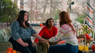 Brooke Elliott as Dana Sue Sullivan, Heather Headley as Helen Decatur and JoAnna Garcia Swisher as Maddie Townsend talking to each other on a porch in sweet magnolia season 4