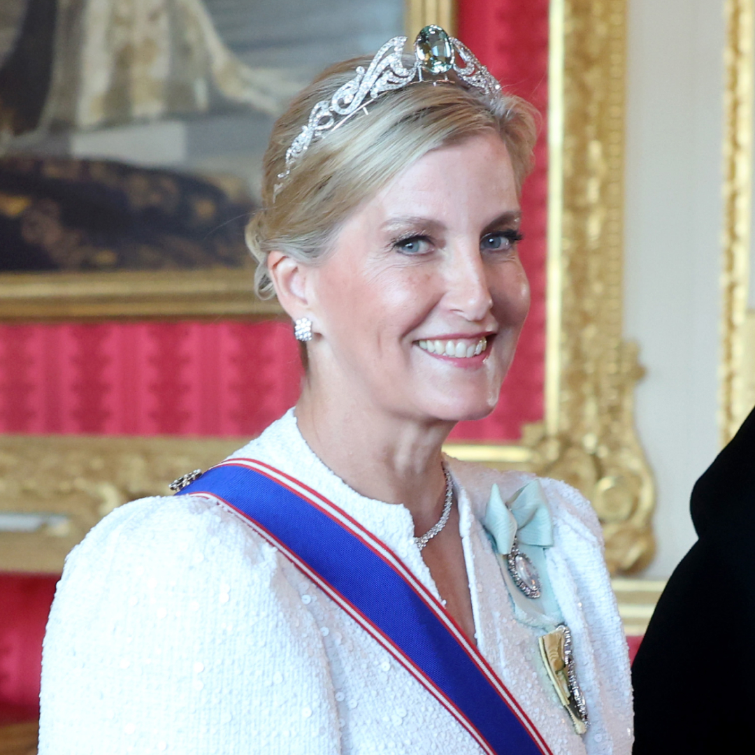Duchess Sophie wearing a white dress and diamond tiara smiling 
