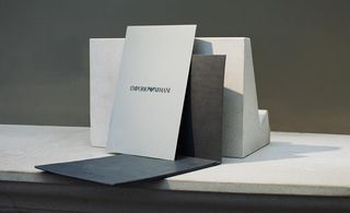 white card with grey leather envelope