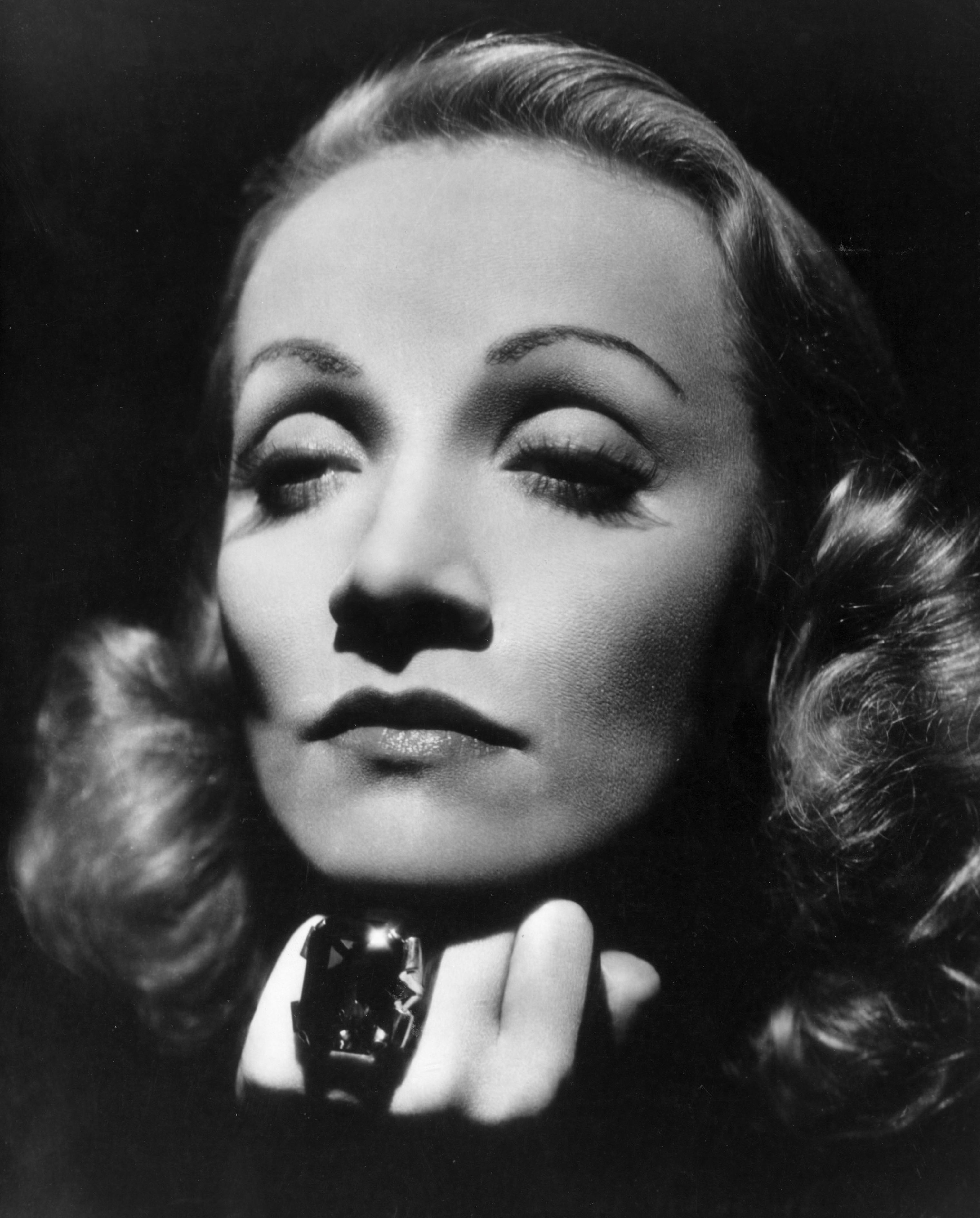 black and white photo of Marlene Dietrich with thin brows