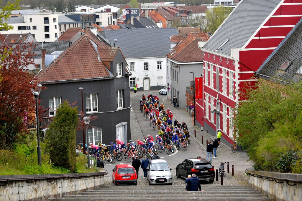OVERIJSE BELGIUM APRIL 14 The peloton during the 61st De Brabantse Pijl La Flche Brabanonne 2021 Mens Elite a 2017km race from Leuven to Overijse 106m Village Landscape Public Fans BP21 FlandersClassic on April 14 2021 in Overijse Belgium Photo by Luc ClaessenGetty Images
